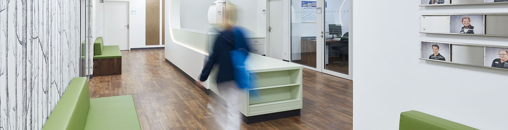 Clinic corridor with nurses' station in a modern, white design Clinic corridor with nurses' station in a modern, white design