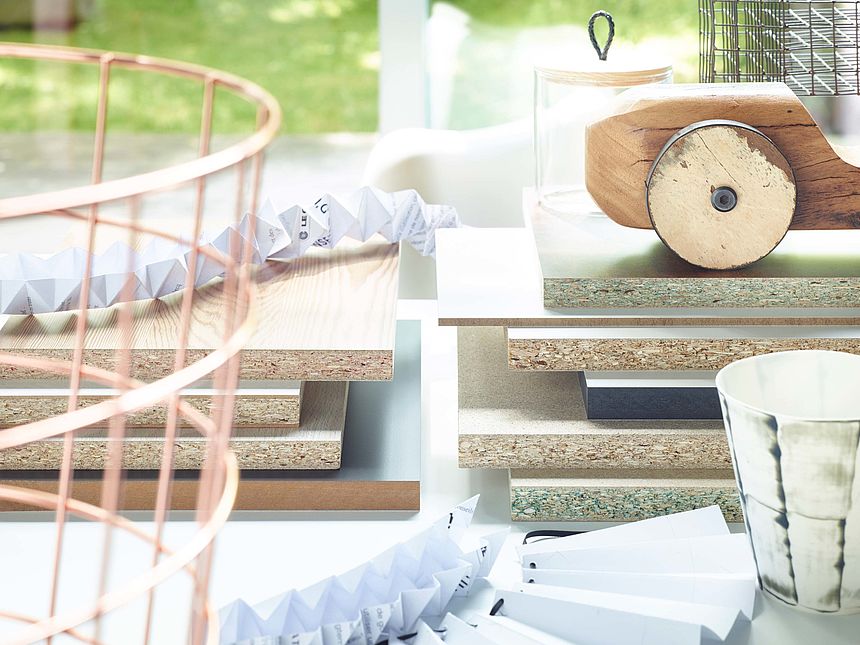Pfleiderer decorative melamine faced particleboard A stack of various decorative melamine faced particleboards