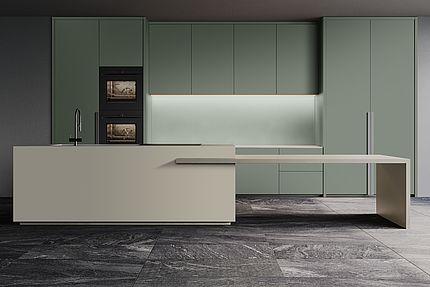 Sage green kitchen featuring a beige island Decor-matched backsplash panel