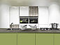 A white kitchen with a green cooking island covered with a grey Pfleiderer Compact worktop.