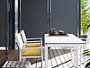 Terrace equipped with furniture made of XTerior compact by Pfleiderer.