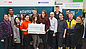 The apprentices and training staff at the Neumarkt joint training centre with the donation cheque to the association "Für Menschen in Not e. V." (For people in need)