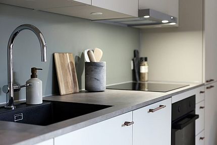 Grey HPL backsplash cladding and countertop Grey HPL backsplash and worktop