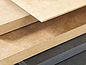 A product stack with different product variants of Pfleiderer fiberboards.
