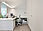 Office with white desk and built-in cabinets